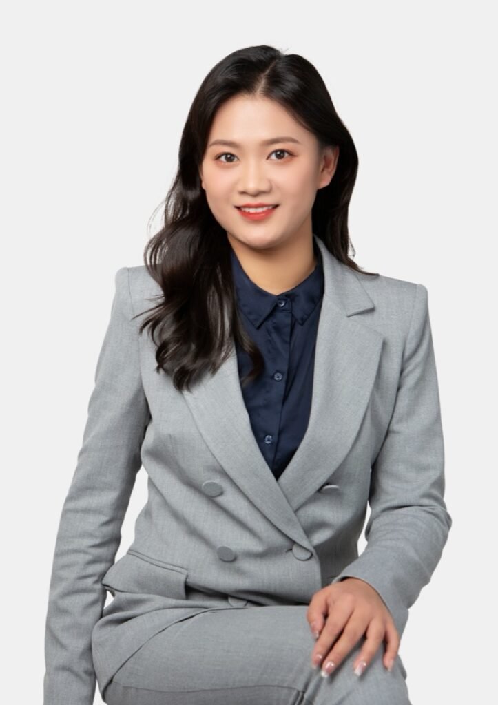 Echo (Zhuqing) Gu, Regulated Canadian Immigration Consultant, in a grey suit